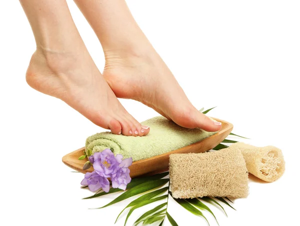 Female feet with towel - spa concept, isolated on white — Stock Photo, Image