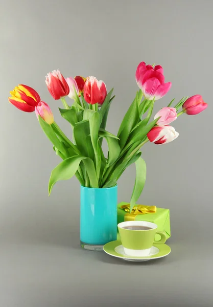 Beautiful tulips in bucket on grey background — Stock Photo, Image