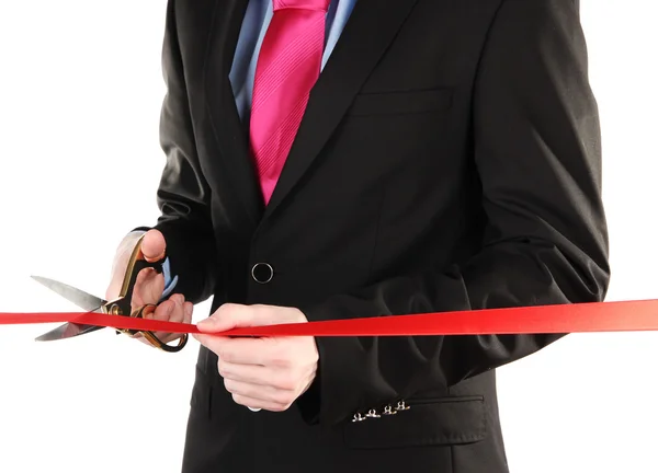 Man's hand snijden rood lint met schaar voor ceremonie geïsoleerd op wit — Stockfoto