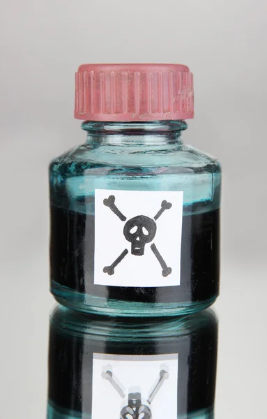 Deadly poison in bottle on grey background — Stock Photo, Image