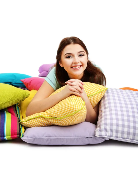 Beautiful young girl with pillows isolated on whit — Stock Photo, Image