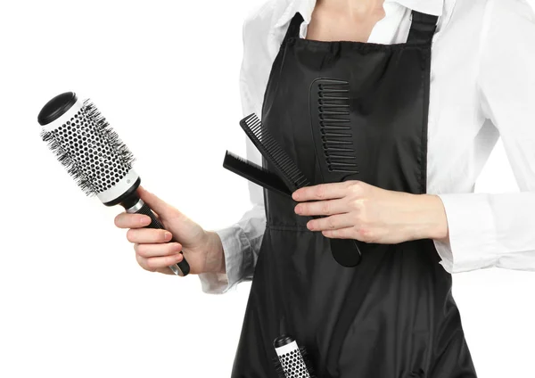 Peluquería en uniforme con herramientas de trabajo, aislado en blanco — Foto de Stock