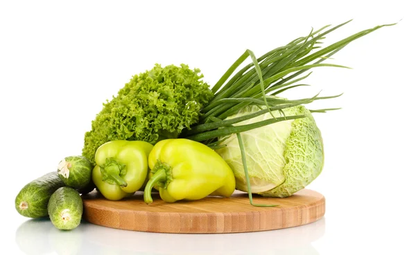 Fresh green vegetables on chopping board isolated on white — Stock Photo, Image