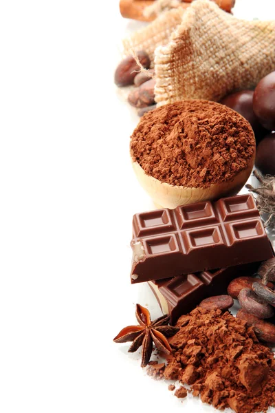 Composition of chocolate sweets, cocoa and spices, isolated on white — Stock Photo, Image