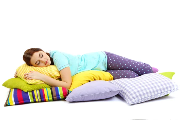Красивая молодая девушка с подушками изолированы на Уит — стоковое фото