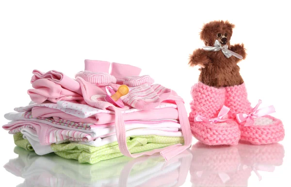 Pile of baby clothes isolated on white Stock Photo