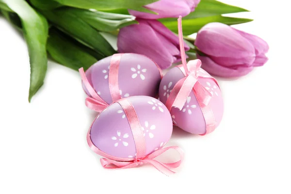 Bright easter eggs and tulips, isolated on white Royalty Free Stock Photos