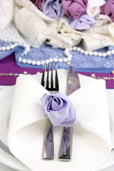 Serving fabulous wedding table in purple color close-up