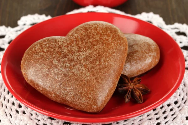 Chocolate cookies in form of heart on wooden table close-up — Stock Photo, Image