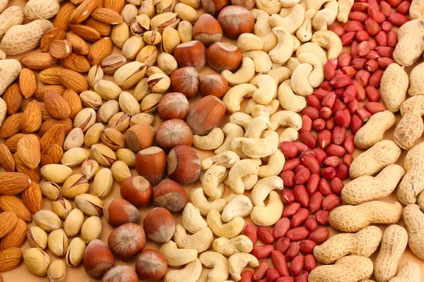 Assortiment van smakelijke noten, close-up — Stockfoto