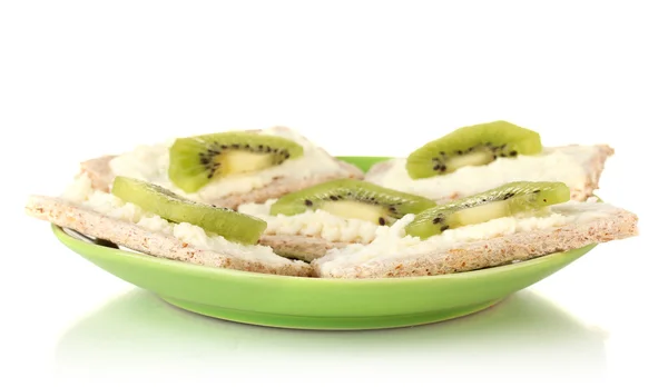 Canapes with cheese and kiwi, on color plate, isolated on white — Stock Photo, Image