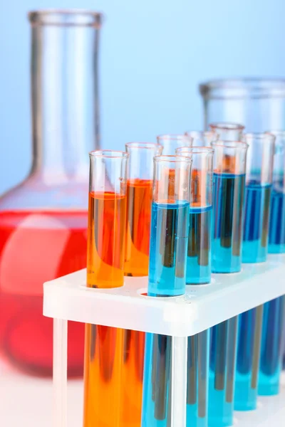 Test-tubes on color background — Stock Photo, Image