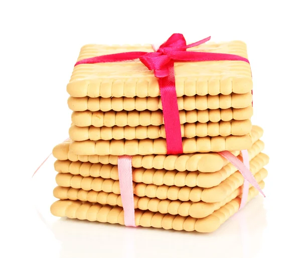 Süße Kekse gebunden mit rosa Bändern isoliert auf weiß — Stockfoto
