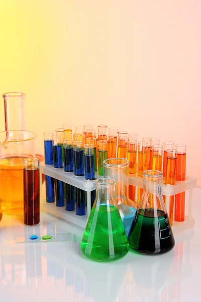 Colorful test tubes on light background — Stock Photo, Image