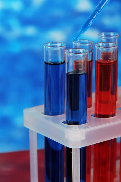 Blue and red test tubes close-up — Stock Photo, Image