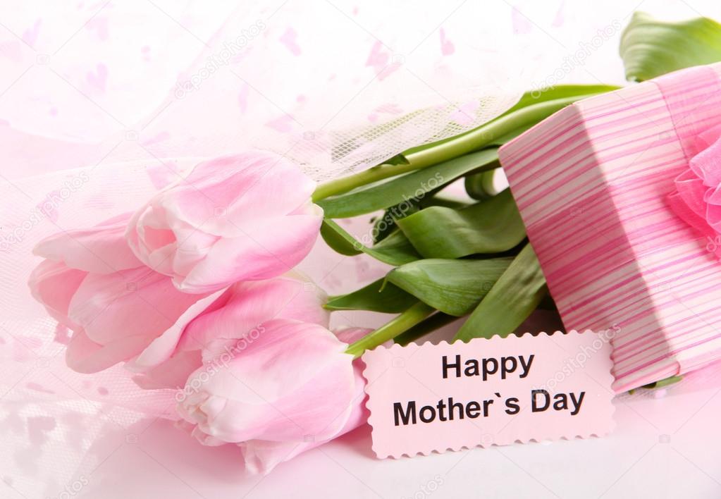 Bouquet of pink tulips and gift for Mother's Day
