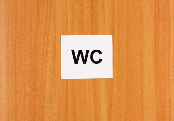木制背景上厕所标志 — 图库照片