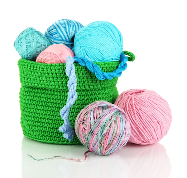 Colorful yarn for knitting in green basket isolated on white — Stock Photo, Image