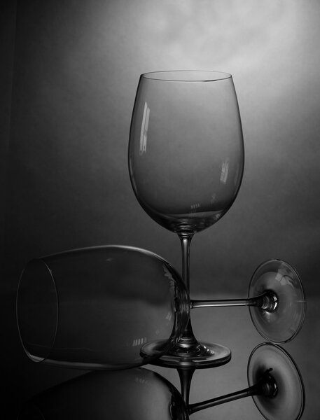 Empty wine glasses arranged on grey background