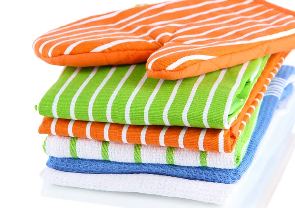 Orange potholder and stack of kitchen towels isolated on white — Stock Photo, Image