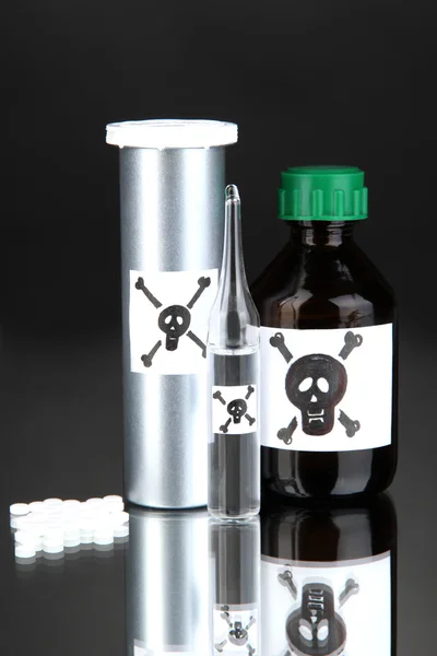 Deadly poison in bottles on black background — Stock Photo, Image