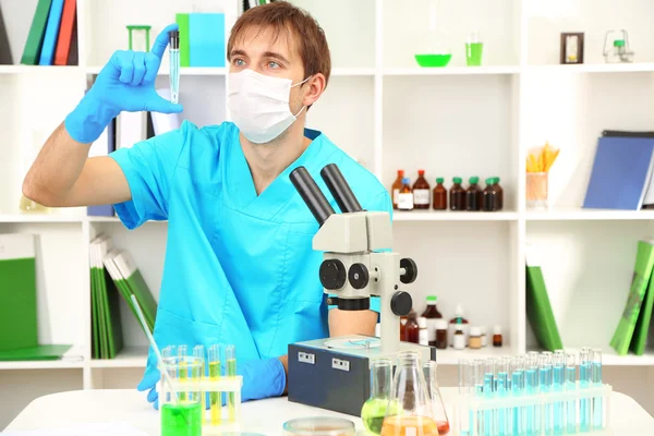 Assayer during research on room background — Stock Photo, Image