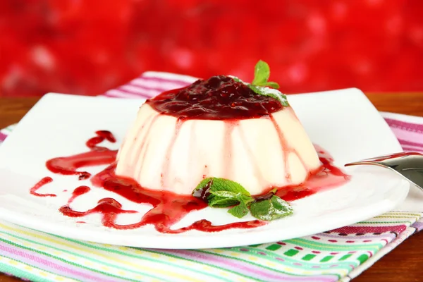 Panna Cotta with raspberry sauce, on bright background — Stock Photo, Image