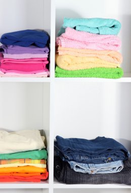Clothes neatly folded on shelves