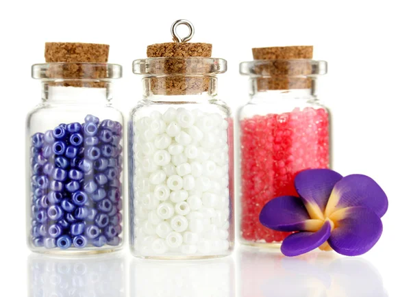 Little bottles full with colorful beads isolated on white — Stock Photo, Image