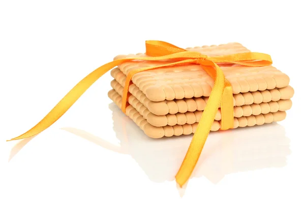 Beyaz izole sarı kurdele ile bağlanmış tatlı kurabiye — Stok fotoğraf