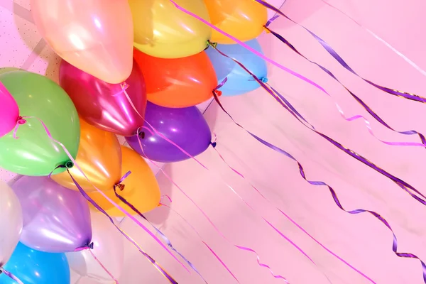 Many bright balloons under ceiling close-up — Zdjęcie stockowe