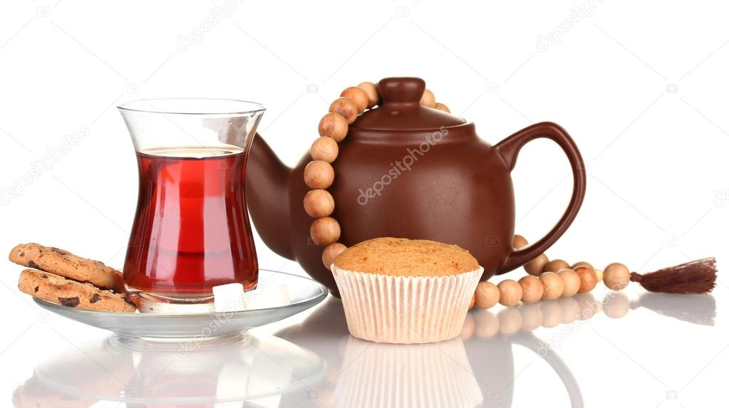 glass of Turkish tea and kettle isolated on white