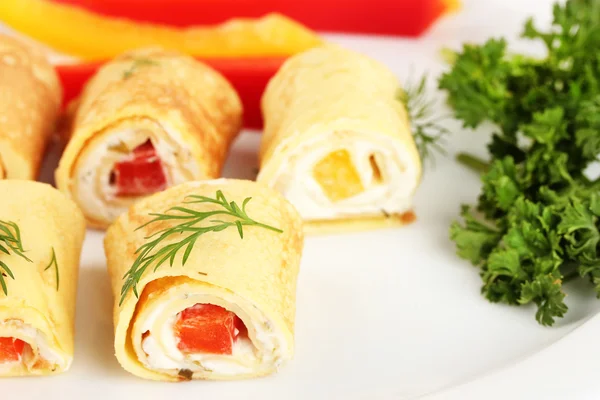 Egg rolls with cheese cream and paprika,on plate, close up — Stock Photo, Image