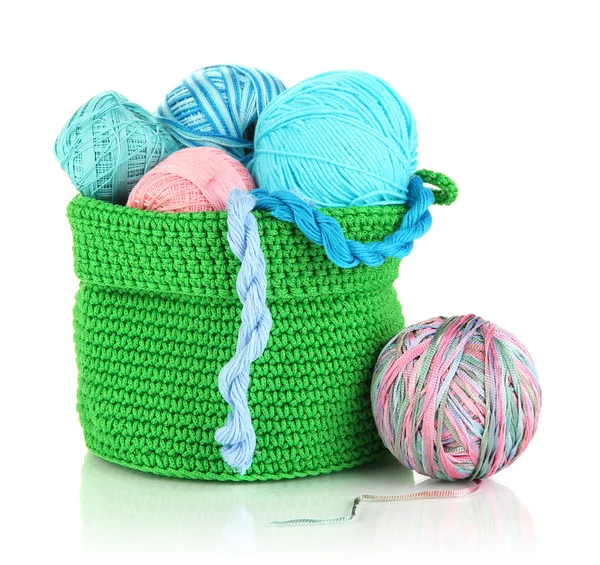 Colorful yarn for knitting in green basket isolated on white — Stock Photo, Image