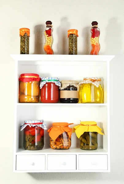 Homemade preserves on beautiful white shelves — Stock Photo, Image