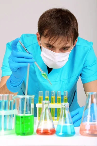 Assayer during research on room background — Stock Photo, Image