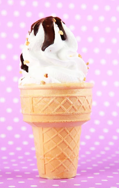 Tasty ice cream with chocolate, on purple background — Stock Photo, Image