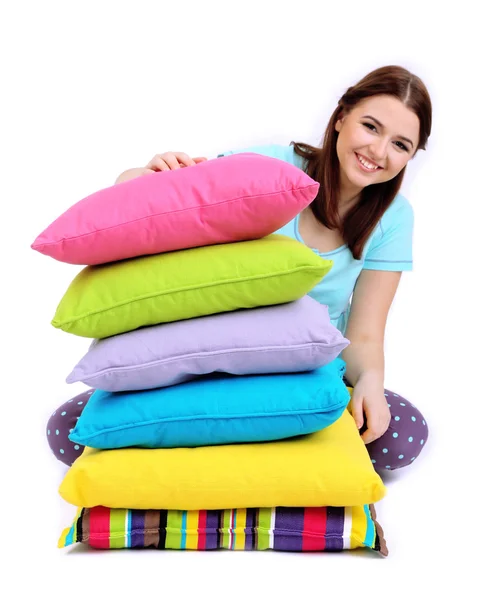 Beautiful young girl with pillows isolated on whit — Stock Photo, Image