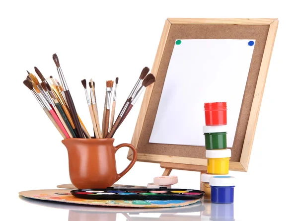 Small easel with sheet of paper and art supplies isolated on white — Stock Photo, Image
