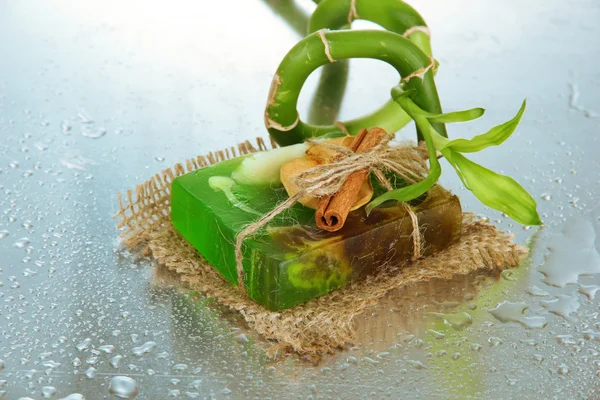 Hand-made soap and bamboo with drops, close up — Stock Photo, Image