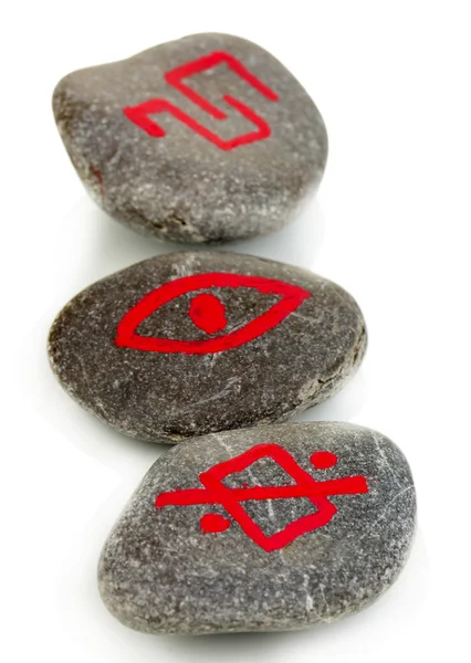 Fortune telling with symbols on stones isolated on white — Stock Photo, Image