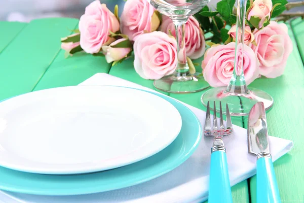 Table serving on a wooden background — Stock Photo, Image