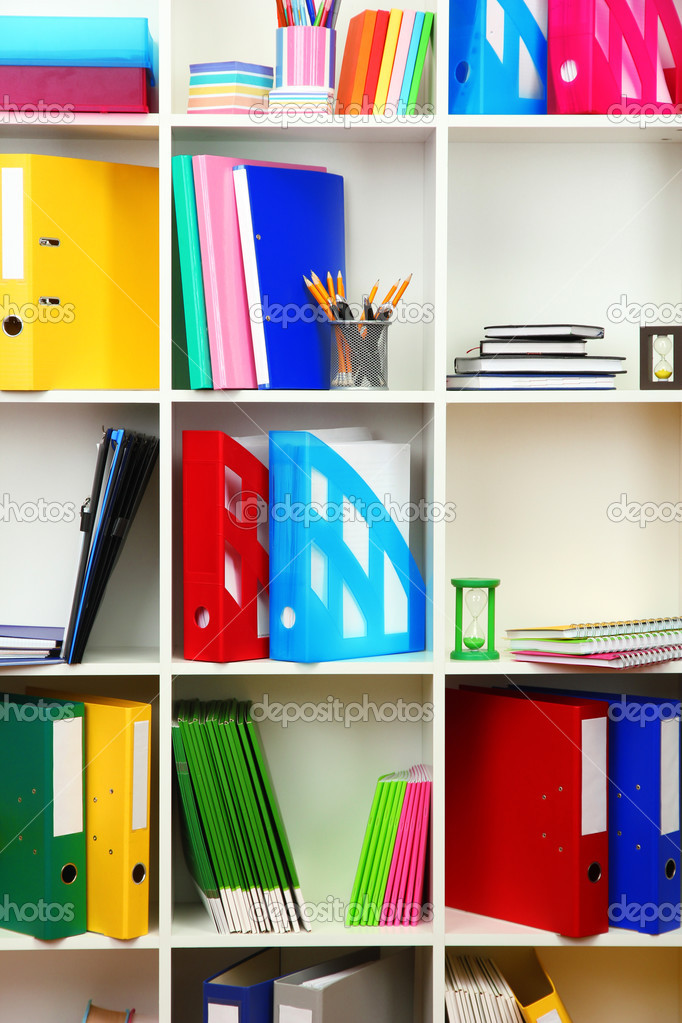 White office shelves with different stationery, close up Stock Photo by