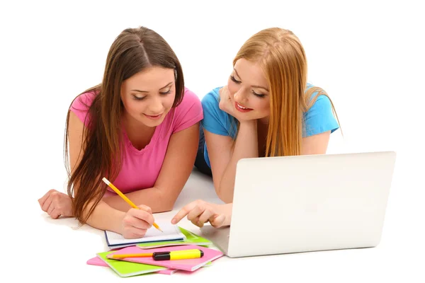 Two girl friends with with laptop isolated on white — Stock Photo, Image