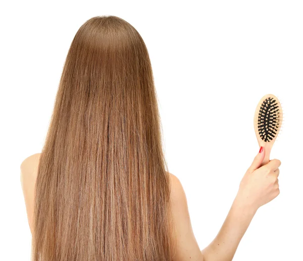 Portret van mooie vrouw met lang haar en een haarborstel, geïsoleerd op wit — Stockfoto