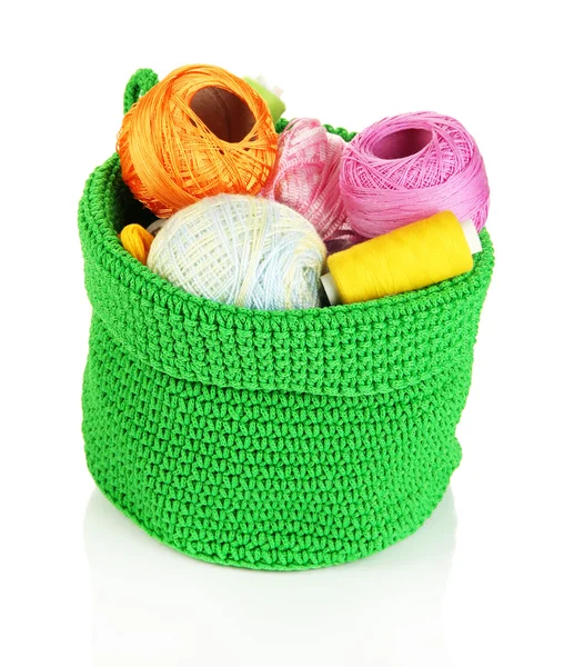 Colorful yarn for knitting in green basket isolated on white — Stock Photo, Image