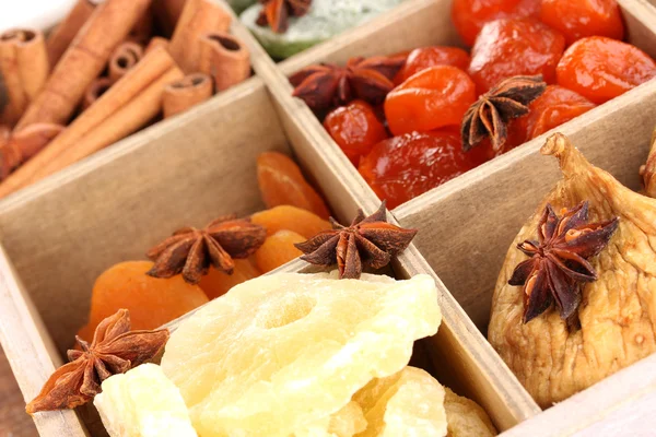 Dried fruits and cinnamon with anise stars in box close-up — Stock Photo, Image