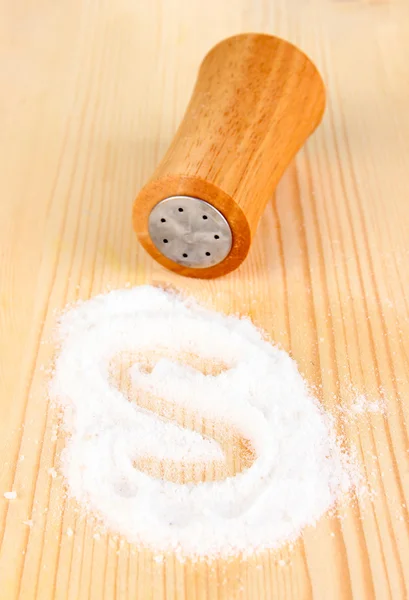 Wooden salt shaker on wooden background — Stock Photo, Image