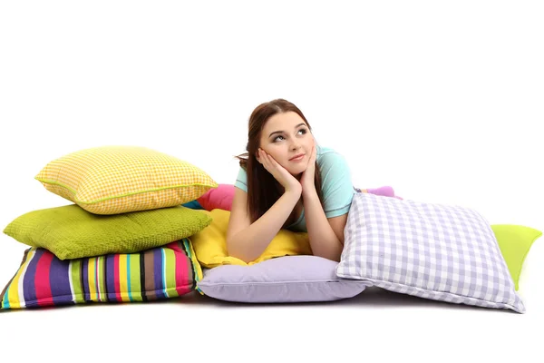 Beautiful young girl with pillows isolated on whit — Stock Photo, Image