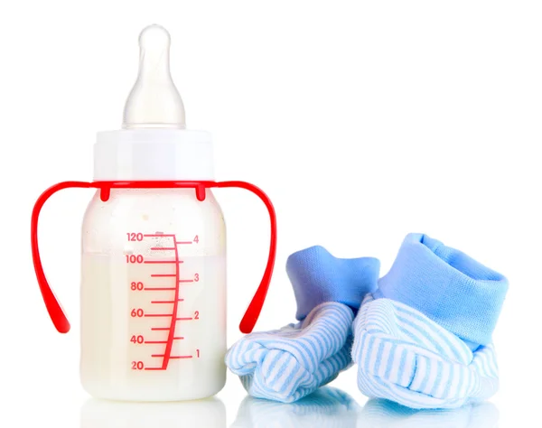 Fles voor melk formule met laarsjes geïsoleerd op wit — Stockfoto